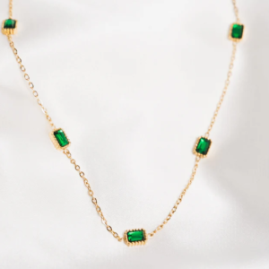 Gold necklace with squares of emerald jewel